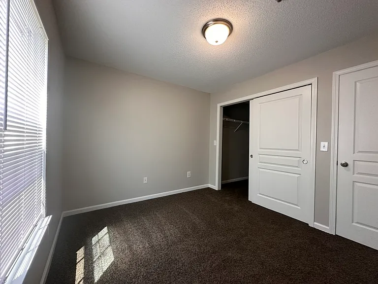 Downstairs 3 Bedroom Unit- Back Bedroom