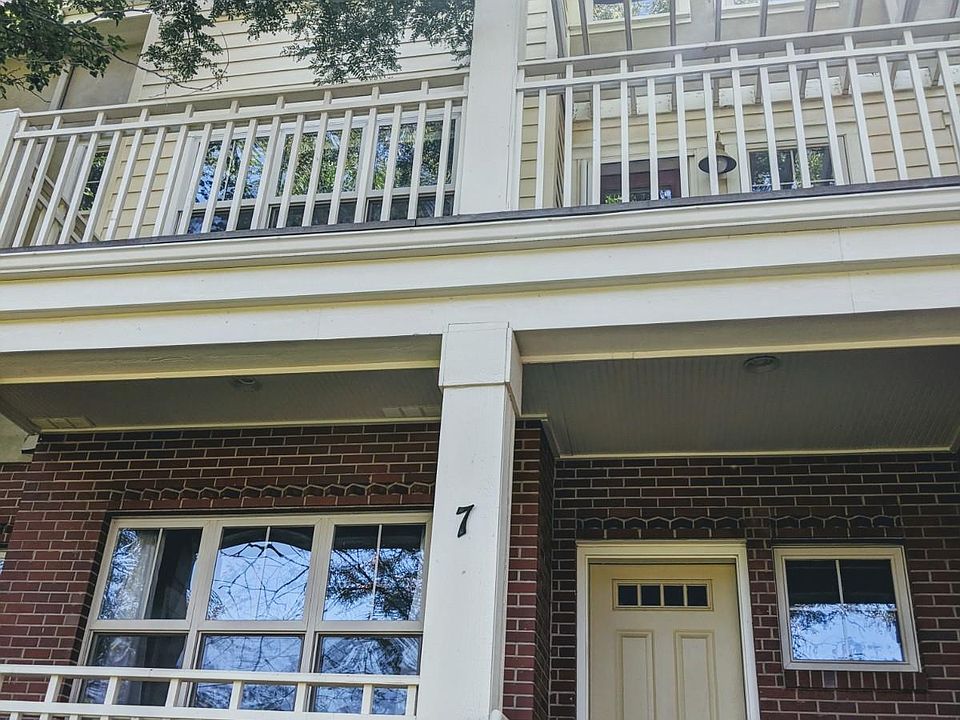 Unit 7 entrance and porch, with second story deck.