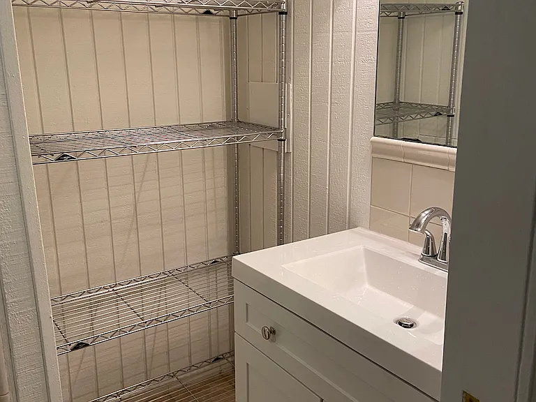 Bath vanity and shelving.