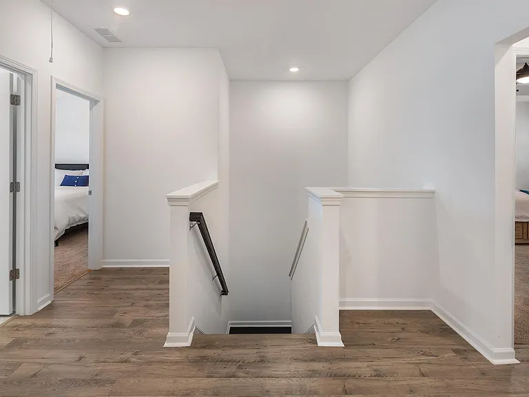 Hallway and stairwell guiding you up to the loft area.