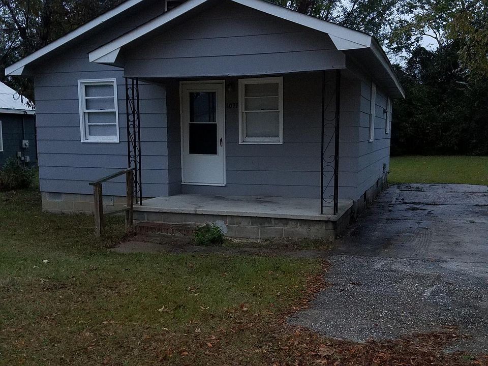 Front of Home that has concrete Driveway on a 1/4 acre Lot