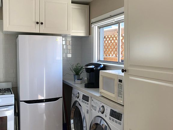 Kitchen with full sized washer/dryer