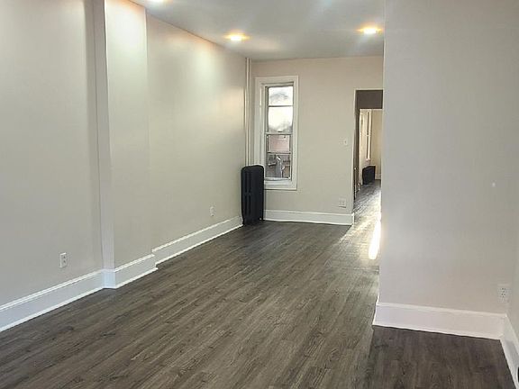 Spacious living room with beautiful flooring
