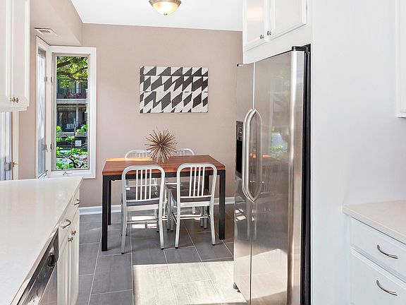 Eat in breakfast nook off the kitchen would also make an adorable office area.