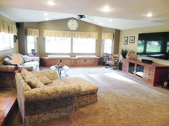 This family room addition was built to entertain a crowd! The window seat with built-in storage adds function.