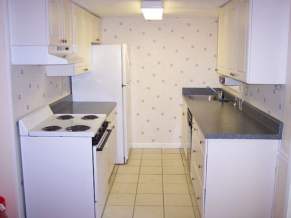 Kitchen with new countertops and tile floor
