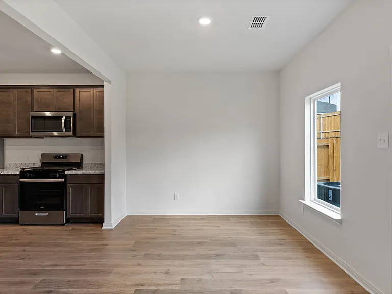 The dining room has a large window.