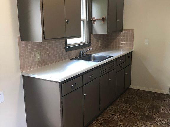 Kitchen- includes second entrance to apt. Fridge & oven/stove provided.