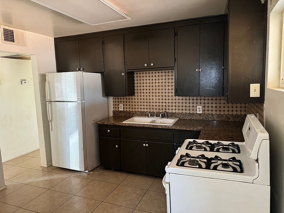Gas stove and granite countertop.