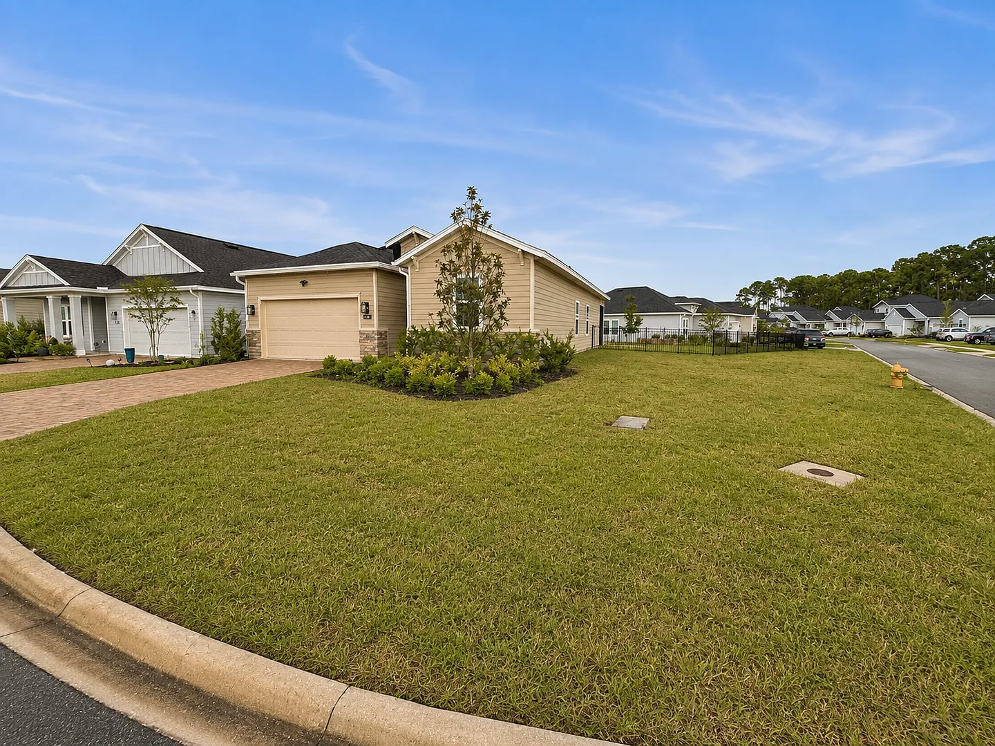 Spacious 4BR/3BA on Large Corner Lot! Water Views, Screened Patio, Double Garage & Outdoor Firepl... — Photo 2