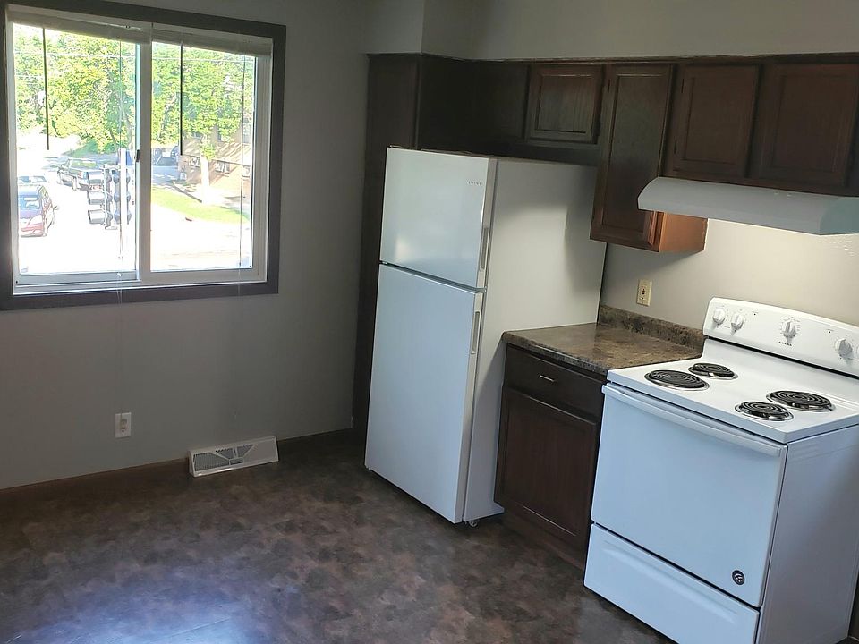Light and roomy kitchen with new fridge and stove.