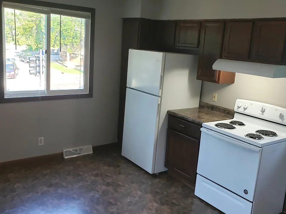 Light and roomy kitchen with new fridge and stove.