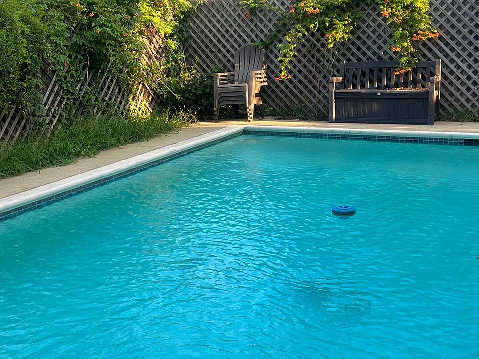 Backyard oasis with private pool, fenced yard, and beautiful mature crepe myrtles.