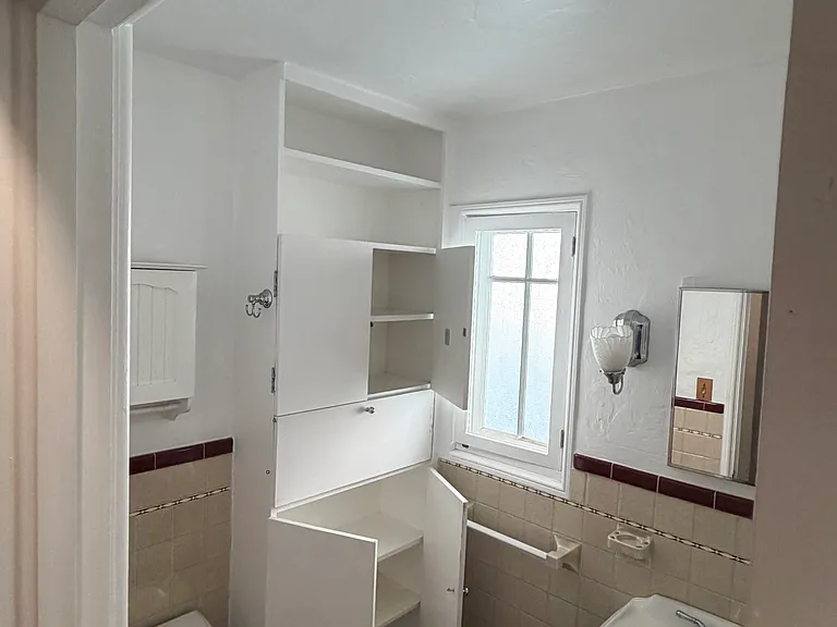 Bathroom, new toilet and vanity, tile and tub original