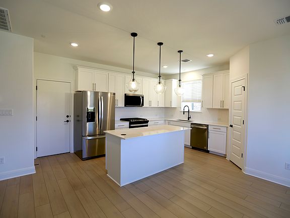 Modern Kitchen: Equipped with brand new Whirlpool appliances, Kitchen Island and a large pantry.