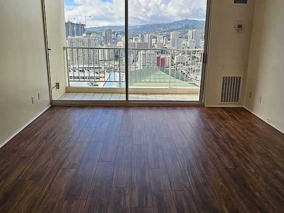 New Koa vinyl flooring and fantastic city and mountain views from the living room, dining room, and kitchen. Enjoy the city lights at night. Custom window coverings have been ordered and will be installed soon.