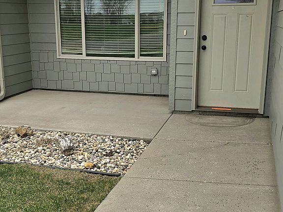 Main entry with covered patio in front.
