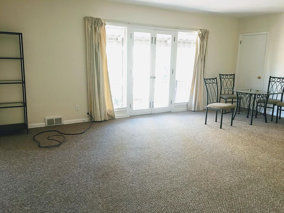 Large Living room with french doors opening to balcony. (furniture not included)