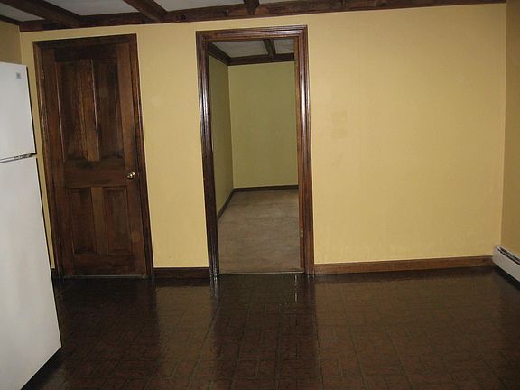 Kitchen dining area. Back bedroom. Entrance to apt. - door on the left.