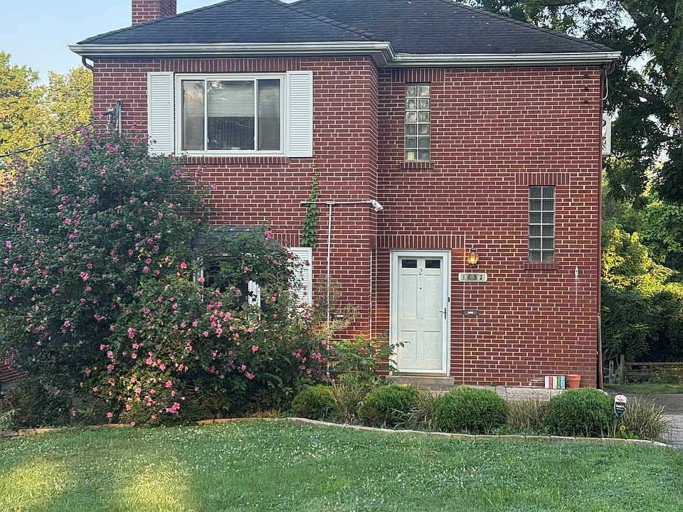 Front- The unit for rent is the 1st floor of this building.