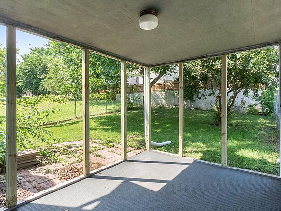 covered porch and fenced back yard