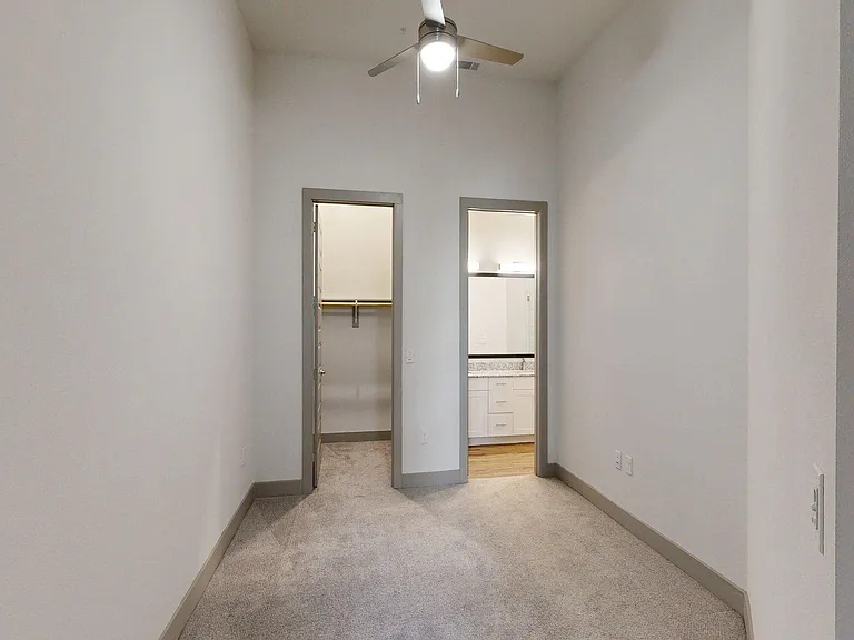 Spacious apartment Bedroom with Carpet Floor.