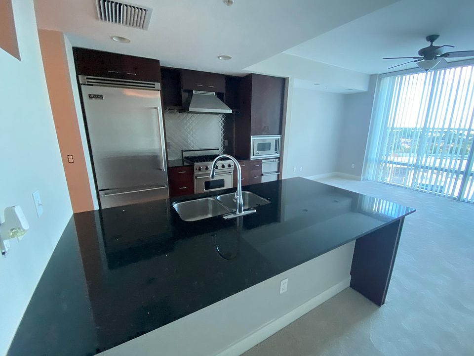 Kitchen area with Bar stool Granite Counter Top.
All Appliances are Viking