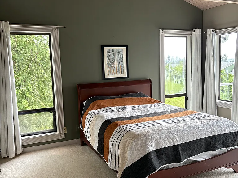 primary bedroom with balcony and fireplace