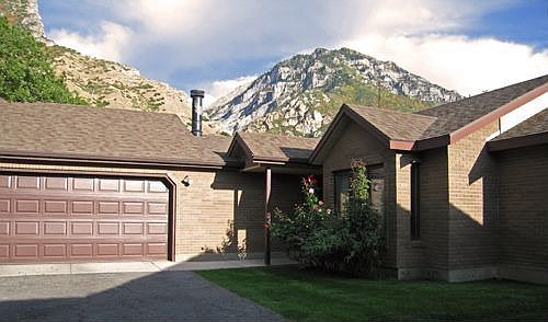 2-car garage, wood burning stove, and a fireplace, GREAT view of Rock Canyon!