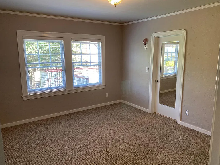 Main bedroom. Carpet with walk-in closets.