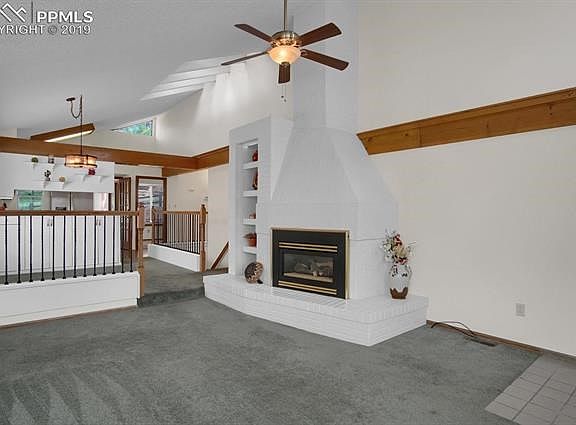 Bright living room opens to dining area