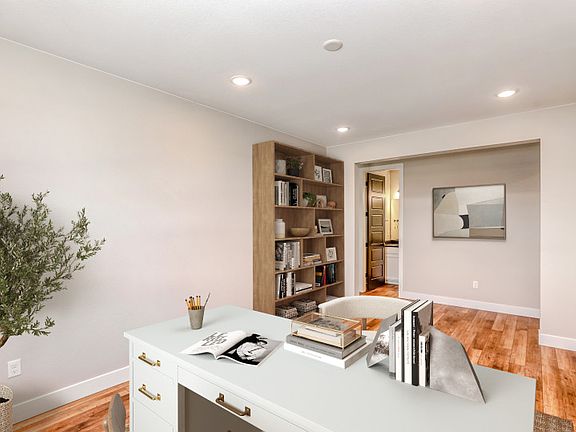 The den is a perfect work from home space that has the option to add stylish French doors for additi