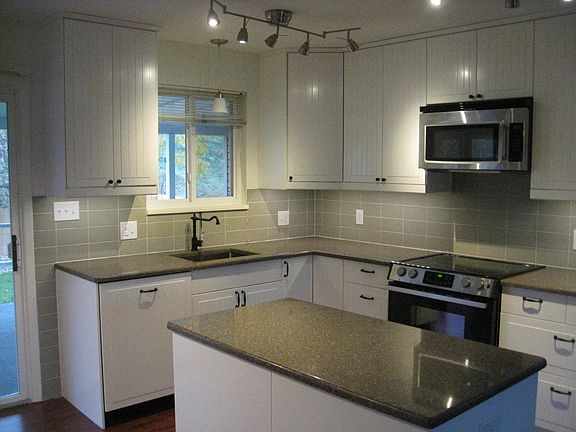 Was totally gutted! Granite, tile, under cabinet lighting!