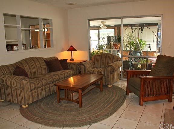 Spacious living room with a sliding door to the sun porch.