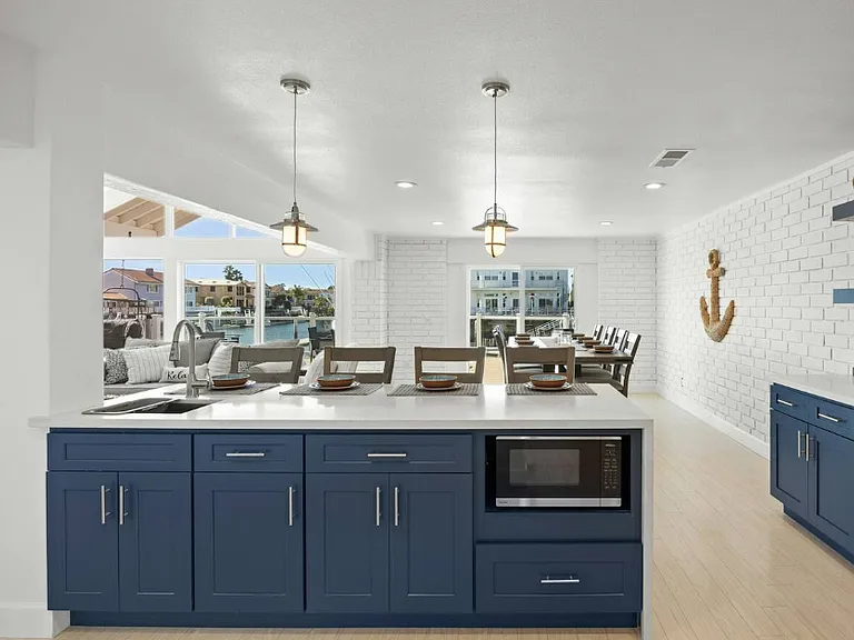 kitchen island with a sink and microwave
