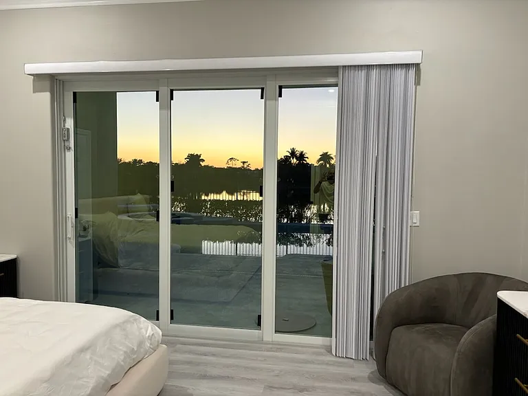 Master Slider Window with vertical blinds