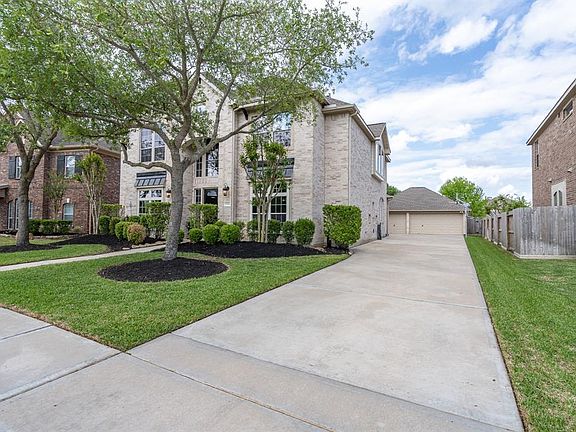 An expansive drive way leads to an oversized detached 3-car garage!