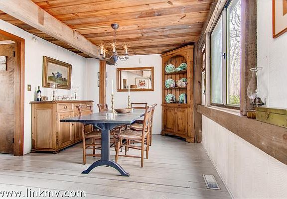 Warm, formal dining room right off the kitchen.
