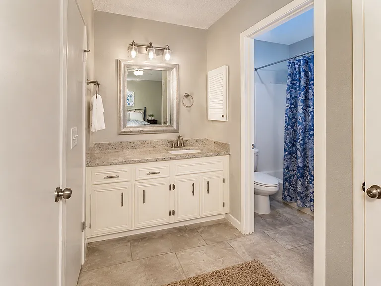 Clean bathroom with a spacious vanity. Everything you need to freshen up before work.