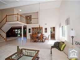 GREAT ROOM EFFECT IS CREATED BY LIVING ROOM, DINING ROOM, STAIRCASE LOFT