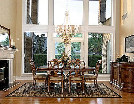 Dining Room overlooks the backyard pool/garden areas and has double doors onto the covered patio.