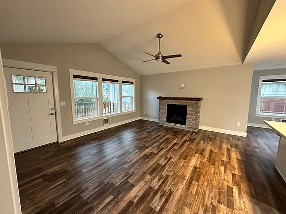Living Room, gas fireplace
Glimpse of dining area at far right
