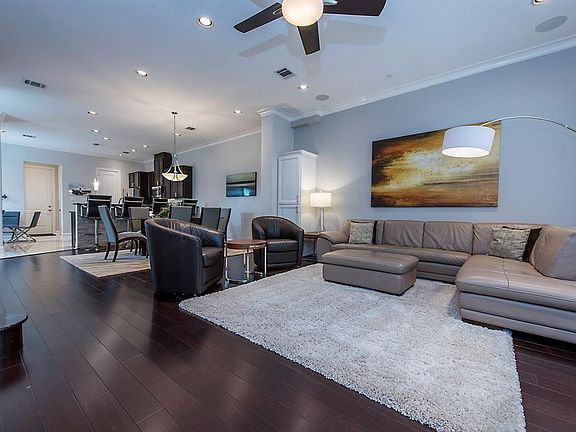 Open plan with gleaming wood floors.