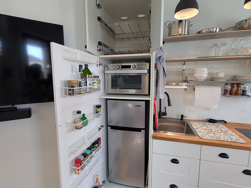 Microwave and Convection Oven, Fridge, Freezer and kitchen storage.