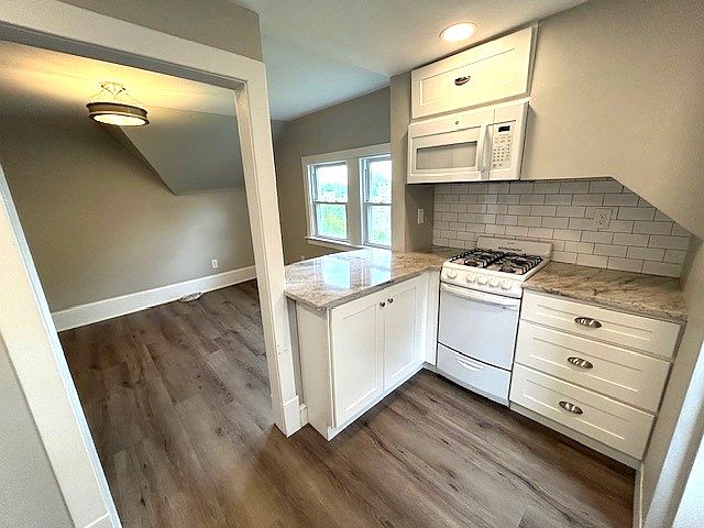 New Kitchen- Granite Countertops, Recessed lighting, Beautiful flooring.