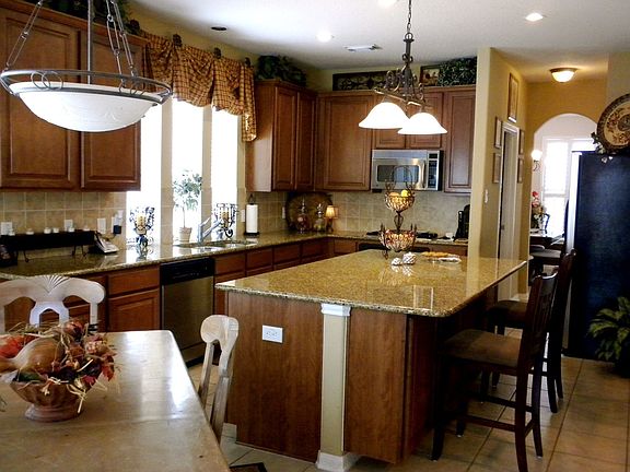 Large Granite kitchen Island, Maple Cabinets, Plenty of lighting