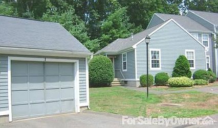 Front View of the Unit
						:
						Ranch-style end unit with detached garage & assigned parking.