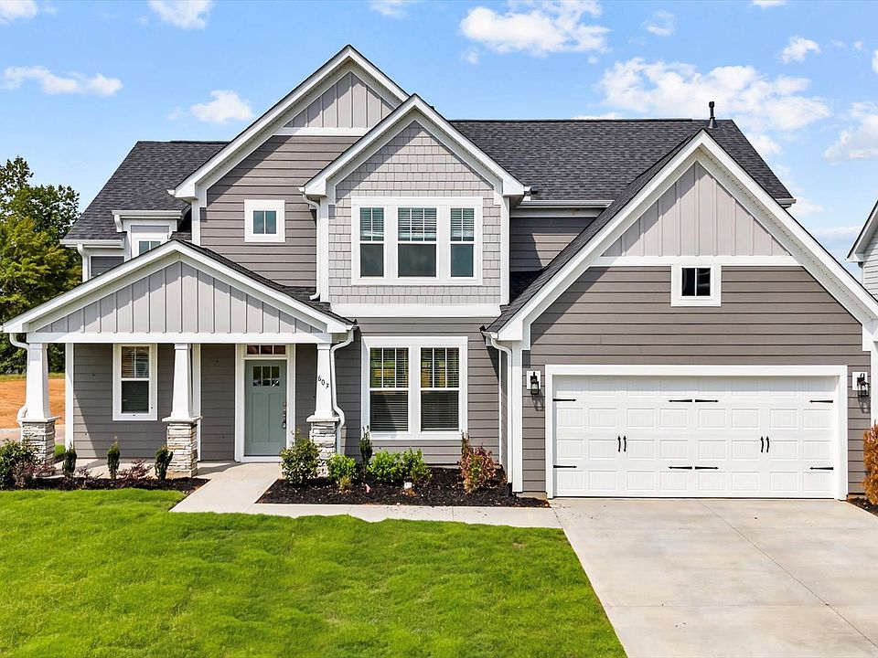 2 story single family home, all white with a 2 car garage