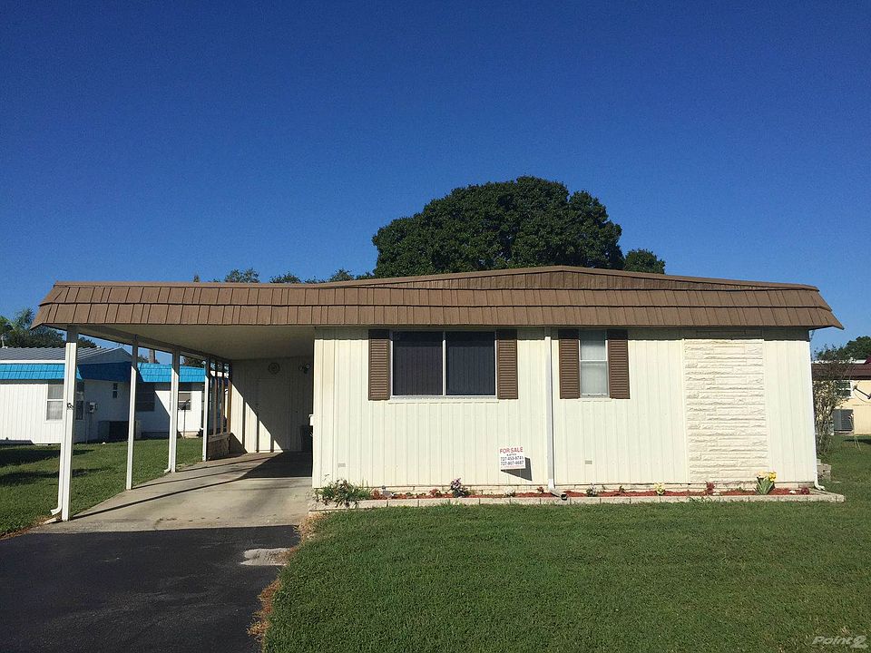 Front of home with carport