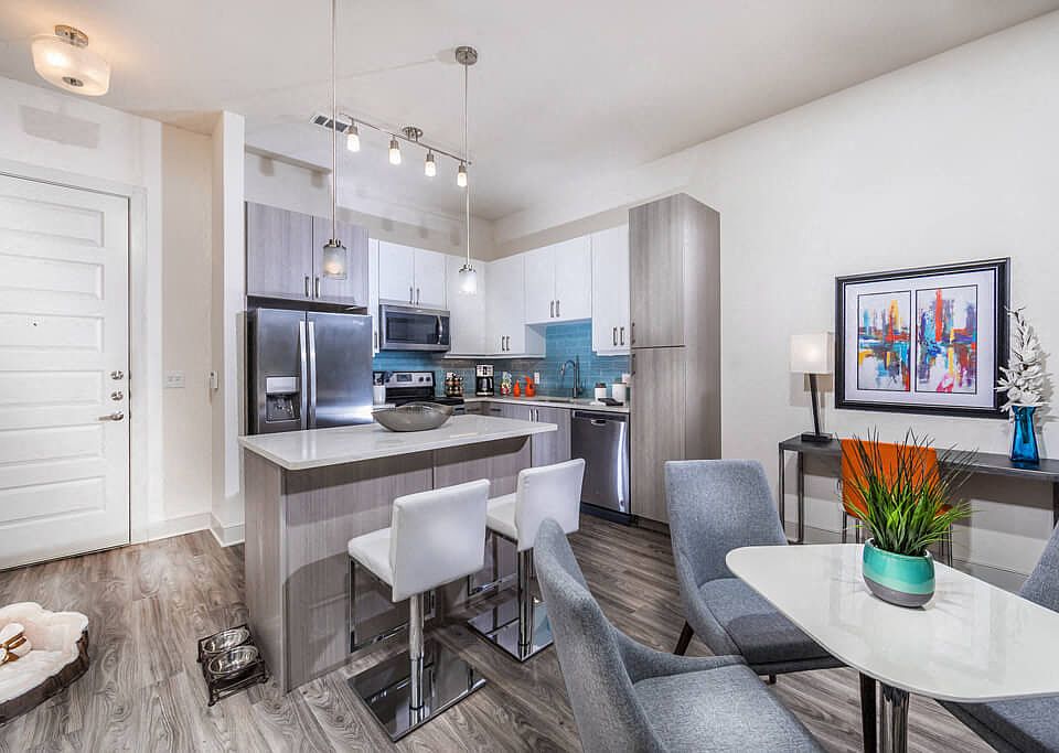 Mist kitchen design package with blue backsplash, tuxedo style cabinets in polished white and gray